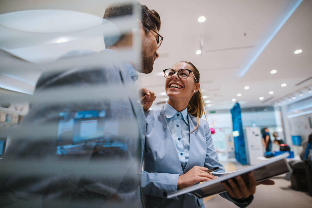 Woman interviewing Customer on their experience while participating at an innovation hub